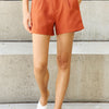 And The Why Every Little Thing Full Size Pleated High Waisted Shorts in Ochre - Caramel