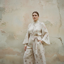 Woman wearing a plus size matching set from Farnelli