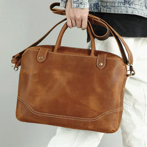 Black leather briefcase from Classy Leather Bags, The Everyday Office Briefcase with sturdy handles and sleek design.