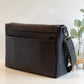 Carry Courage NOMAD messenger bag in coal gray, featuring a streamlined crossbody design