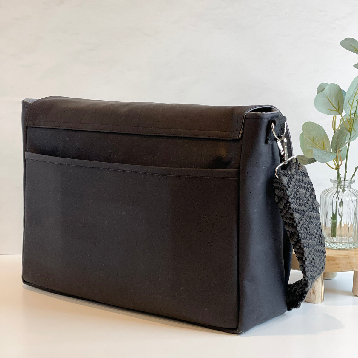 Carry Courage NOMAD messenger bag in coal gray, featuring a streamlined crossbody design
