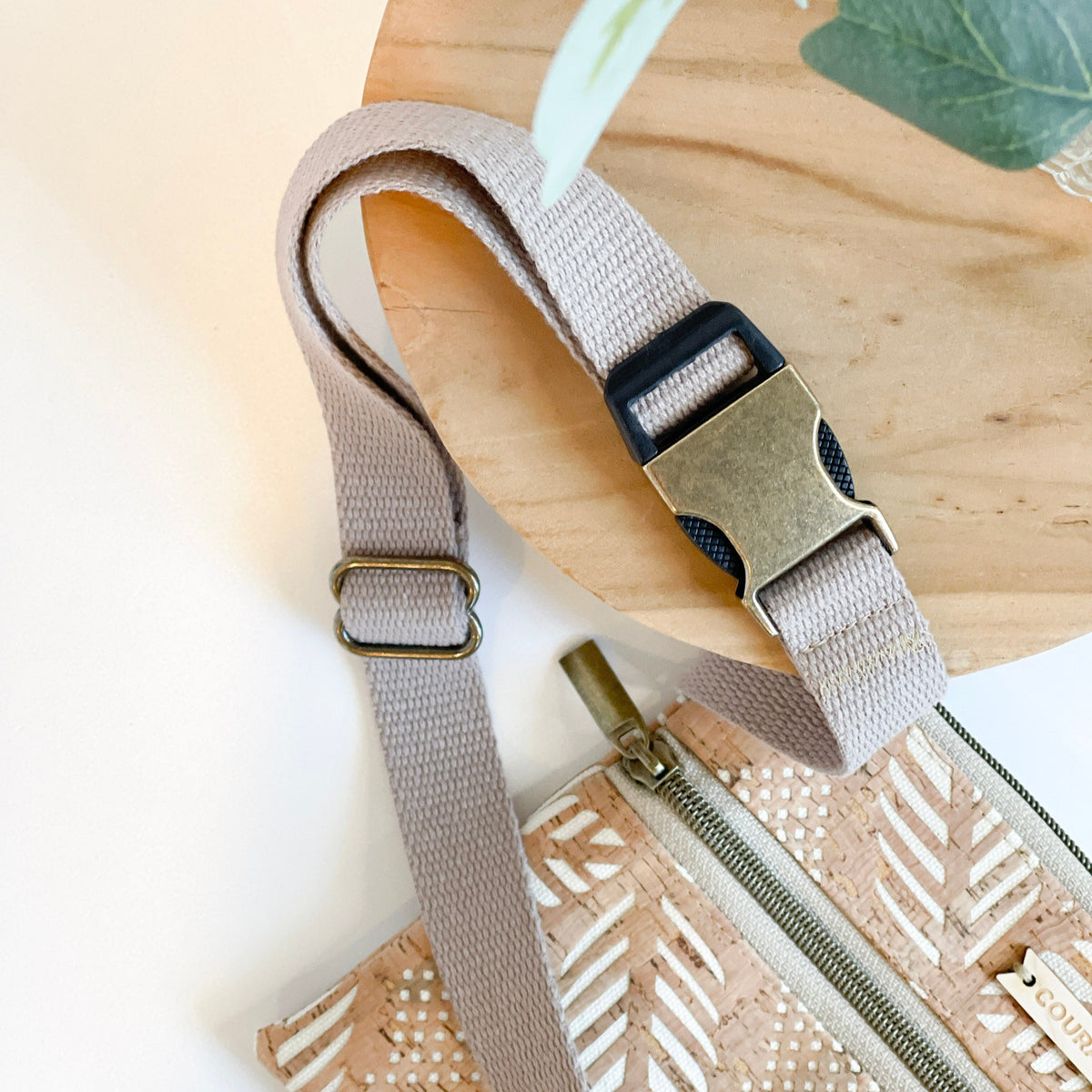 Carry Courage GUARDIAN belt bag in cream, featuring a compact design and adjustable strap