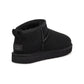 Black UGG women's Classic Ultra Mini boots, side view with low shaft and pull tabs