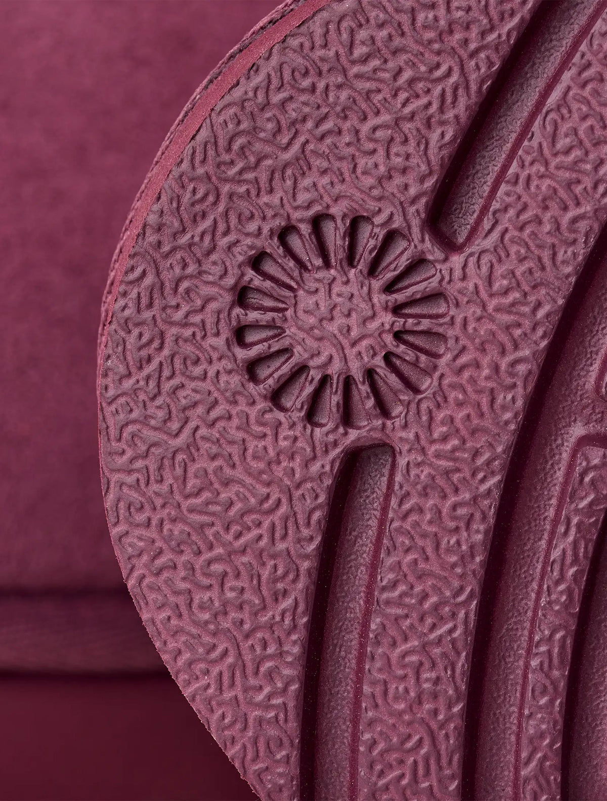 Women's UGG Classic Ultra Mini boots in burnt magenta, side view with low shaft and soft suede finish