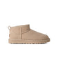UGG Womens Classic Ultra Mini Moonlight boots in soft beige suede, featuring plush sheepskin lining and a durable rubber sole.