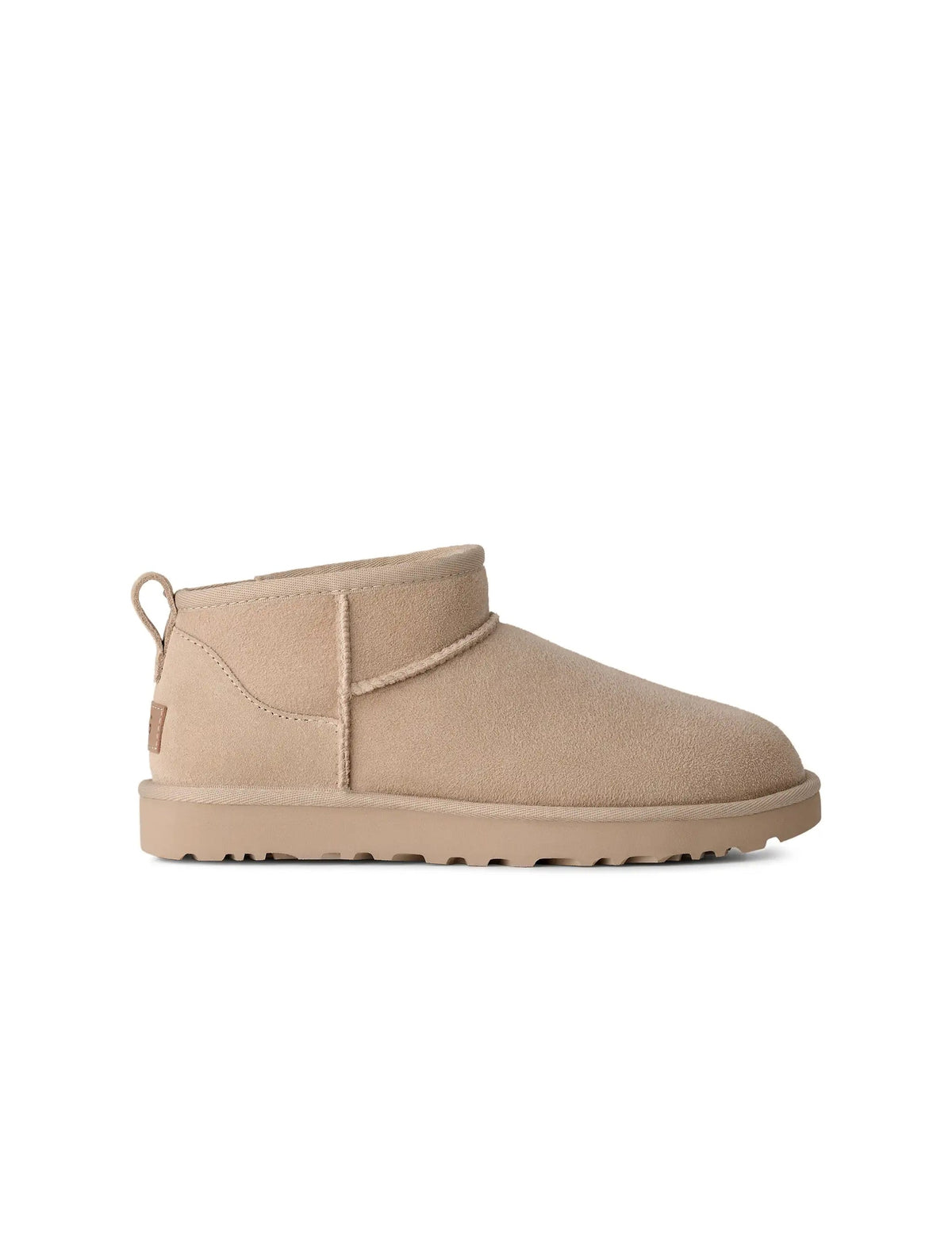 UGG Womens Classic Ultra Mini Moonlight boots in soft beige suede, featuring plush sheepskin lining and a durable rubber sole.