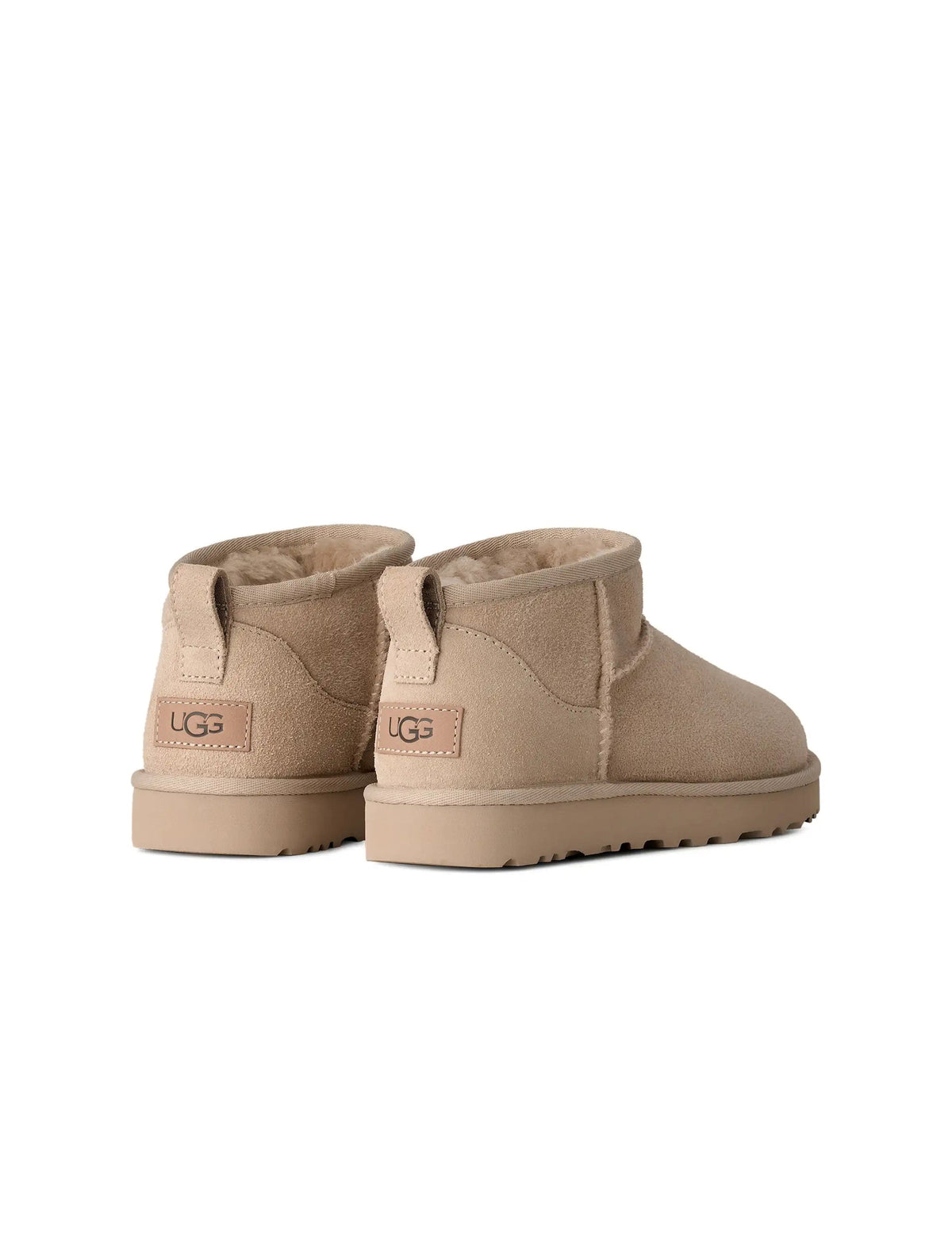UGG Women's Classic Ultra Mini Moonlight boots, stylish denim exchange footwear with plush sheepskin lining and suede exterior.