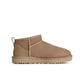 UGG Women's Classic Ultra Mini Sand sneakers with plush lining and suede exterior, stylish footwear for women.