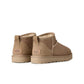 UGG Women's Classic Ultra Mini Sand-colored footwear with sheepskin lining and suede exterior, casual winter shoes.