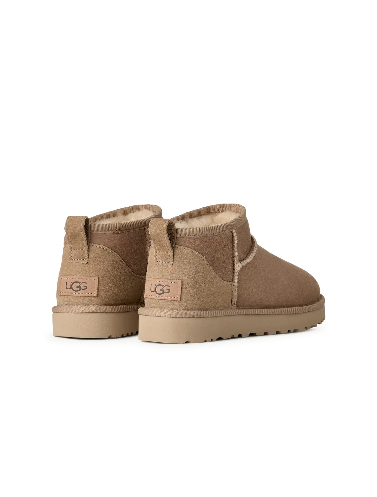 UGG Women's Classic Ultra Mini Sand-colored footwear with sheepskin lining and suede exterior, casual winter shoes.