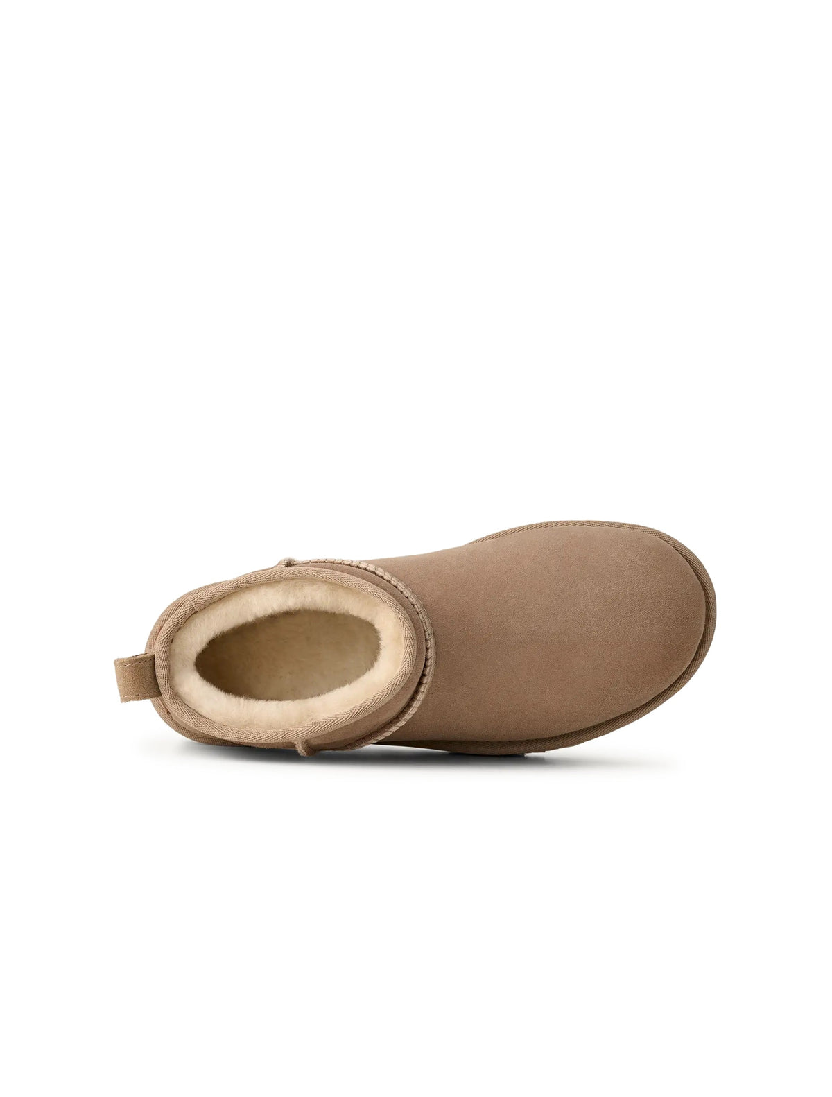 UGG Women's Classic Ultra Mini Sand-colored footwear, stylish and cozy, featuring soft sheepskin and a rugged outsole.