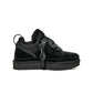 Black UGG Women's Lowmel footwear featuring sleek design and comfortable fit, ideal for casual wear and stylish winter outfits.