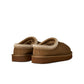 Light bronze UGG Women's Tasman II footwear showing soft suede material and cozy shearling lining, stylishly displayed.