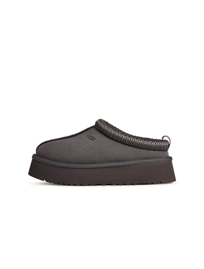 UGG Womens Tazz II Obsidian footwear featuring dark blue suede boots with shearling lining and slip-on design.