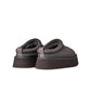 UGG Womens Tazz II Obsidian footwear, black slip-on shoes with cozy sheepskin lining, displayed on a neutral background.