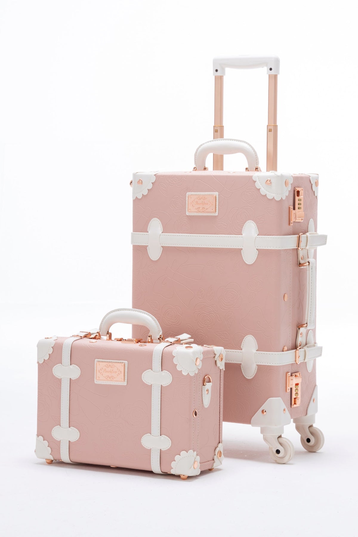 COTRUNKAGE SarahFace 2-piece pink embossed luggage set with durable hard shells and telescopic handles, suitable for travel.