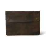 Leather MacBook Folio laptop sleeve by Classy Leather Bags, featuring a sleek, durable design with a smooth textured surface.