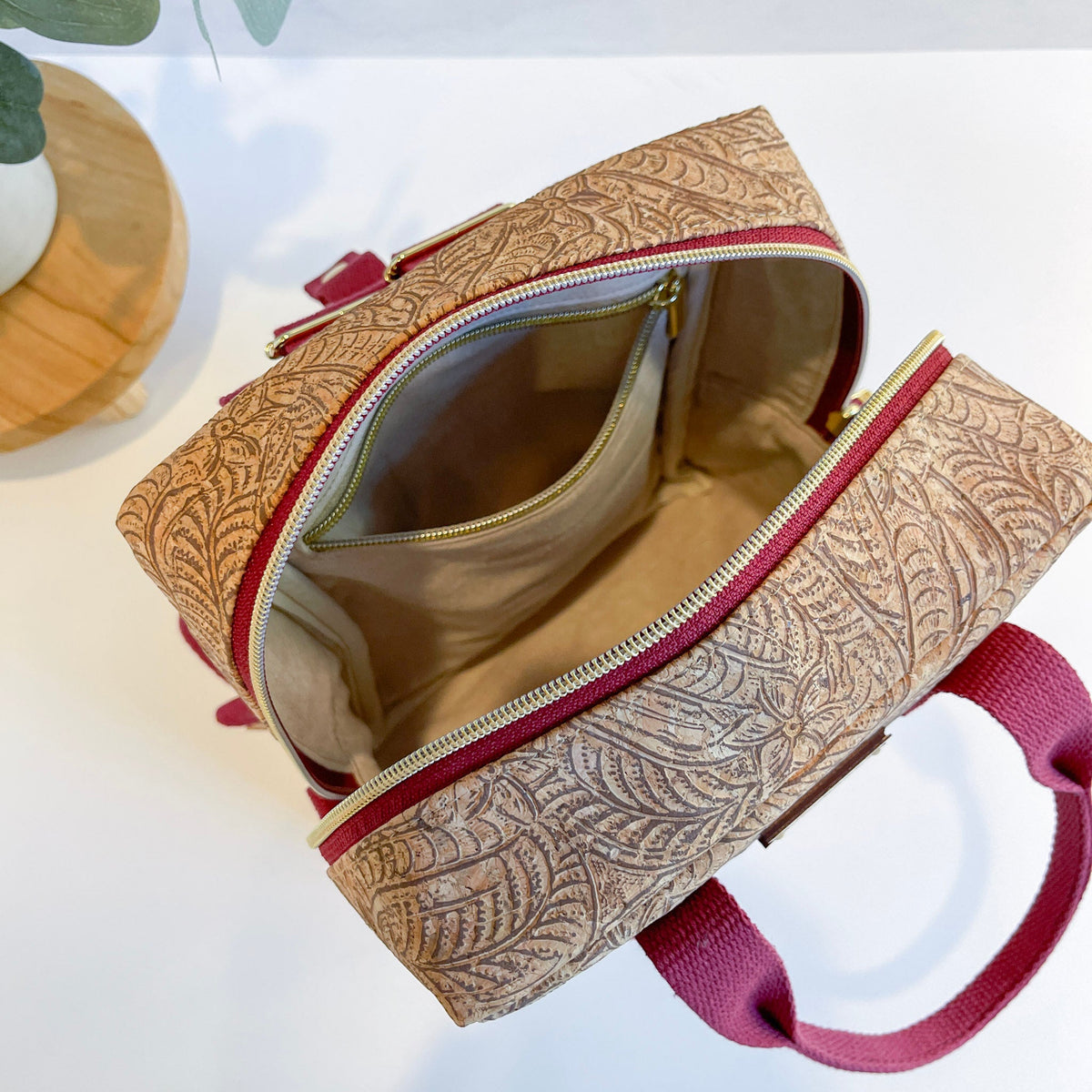 Carry Courage Game Changer mini backpack in a colorful paisley pattern