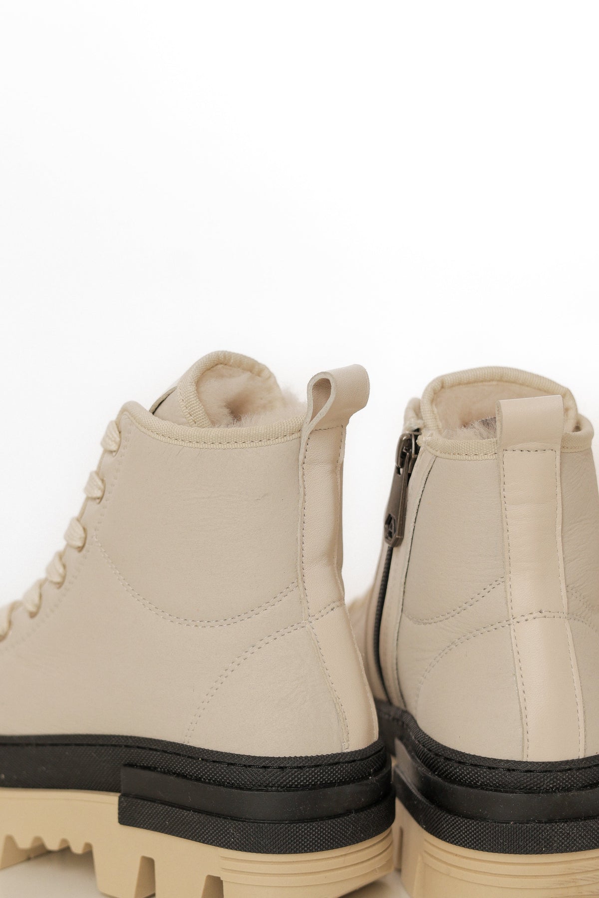 Alaska® Outerwear Company Aspen genuine shearling-lined winter boots with rugged design and warm fur lining.