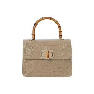 Mini Harriet handbag by thebagicon, showcasing a compact leather design with top handle and modern style.