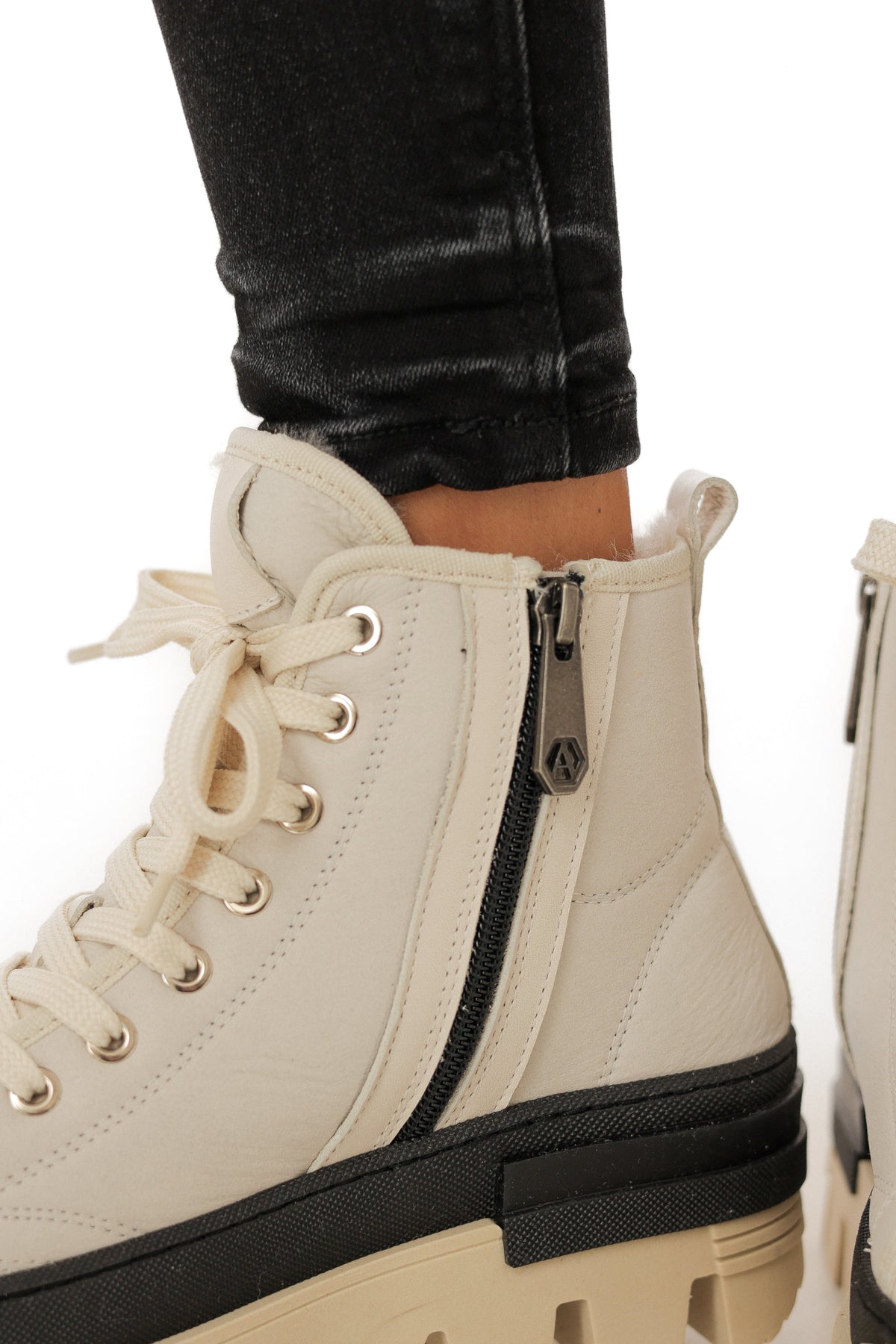 Alaska® Outerwear Company Aspen genuine shearling lined winter boots with rugged leather exterior and cozy fur interior.