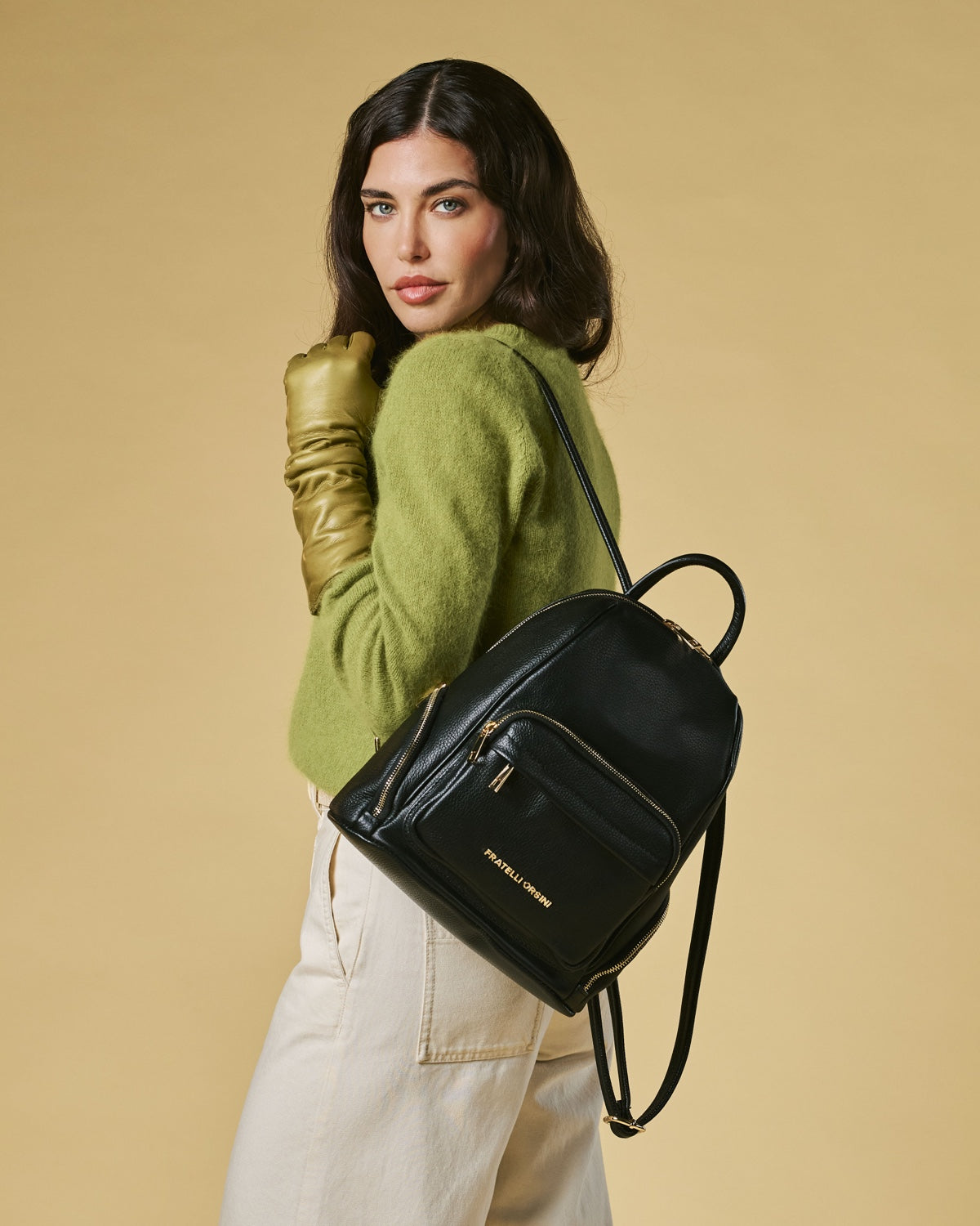 Black Martina Italian calf leather women's backpack with sleek design and adjustable straps, showcasing high-quality craftsmanship.