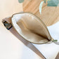 Cream Carry Courage GUARDIAN belt bag with adjustable strap and zippered compartments