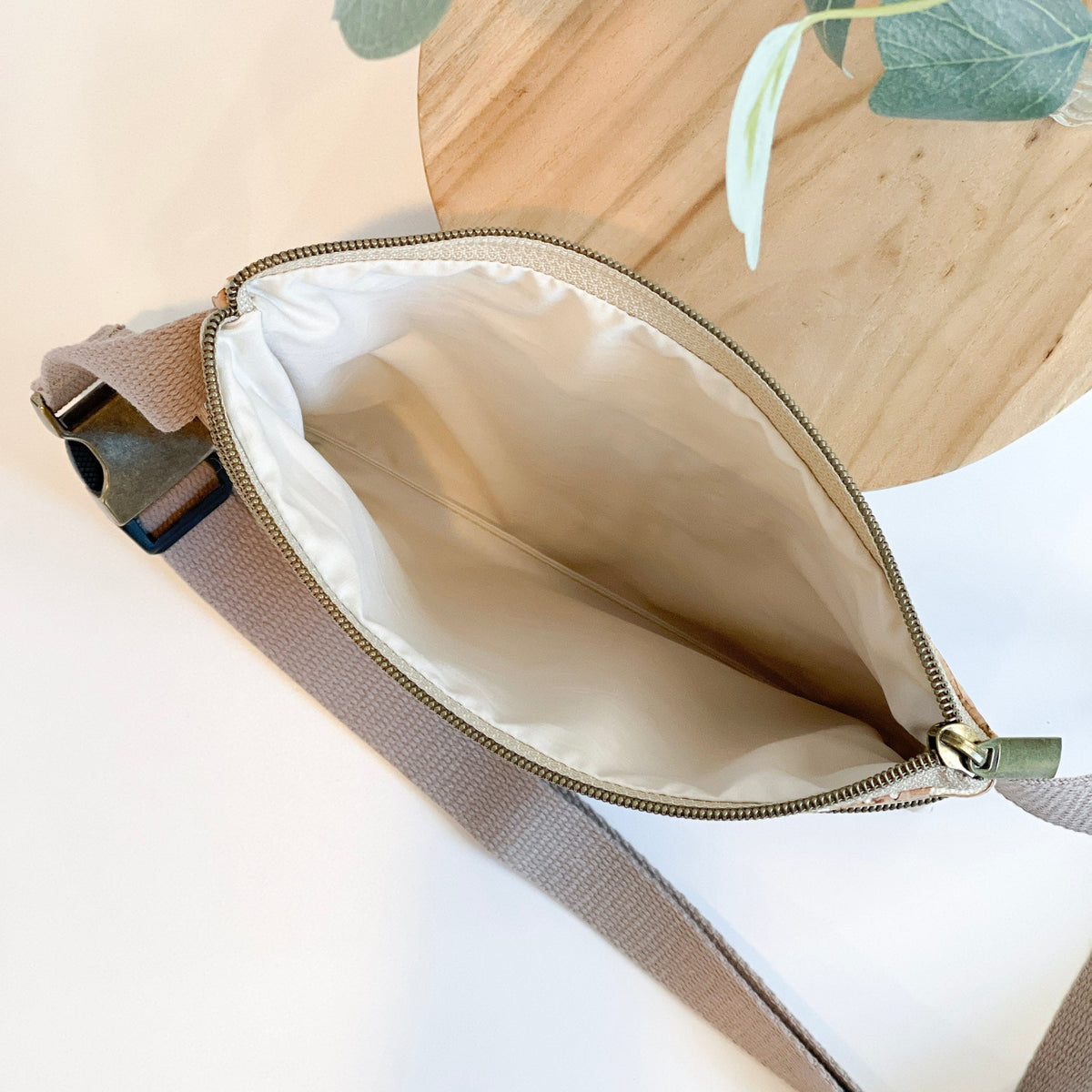 Cream Carry Courage GUARDIAN belt bag with adjustable strap and zippered compartments