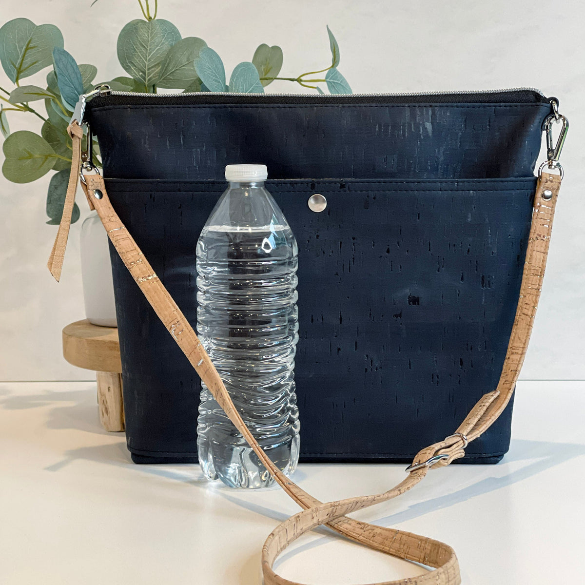 Carry Courage VISIONARY crossbody bag in coal gray with adjustable strap and compact silhouette