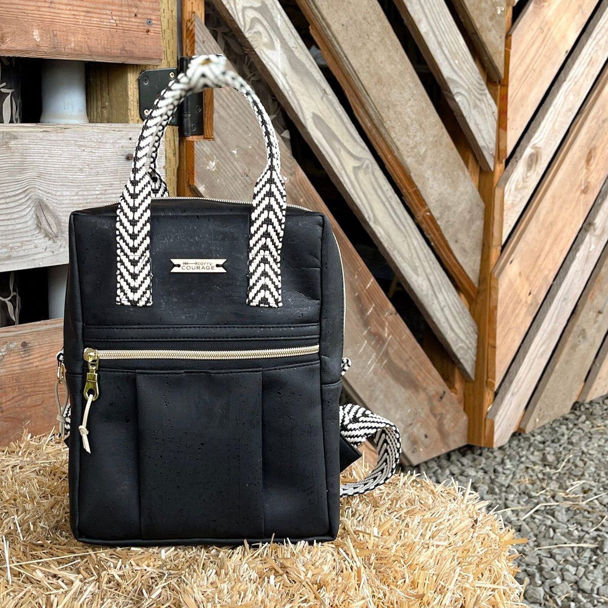 Carry Courage GAME CHANGER mini backpack in coal gray with adjustable straps and compact design