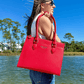 Baldwin Baby Company Montrose diaper bag tote in cardinal red, shown in a lifestyle setting