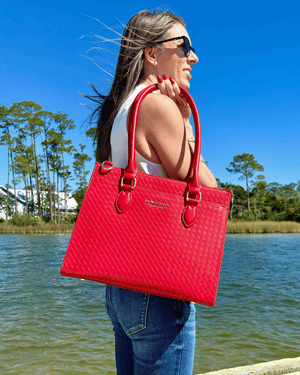 Baldwin Baby Company Montrose diaper bag tote in cardinal red, shown in a lifestyle setting