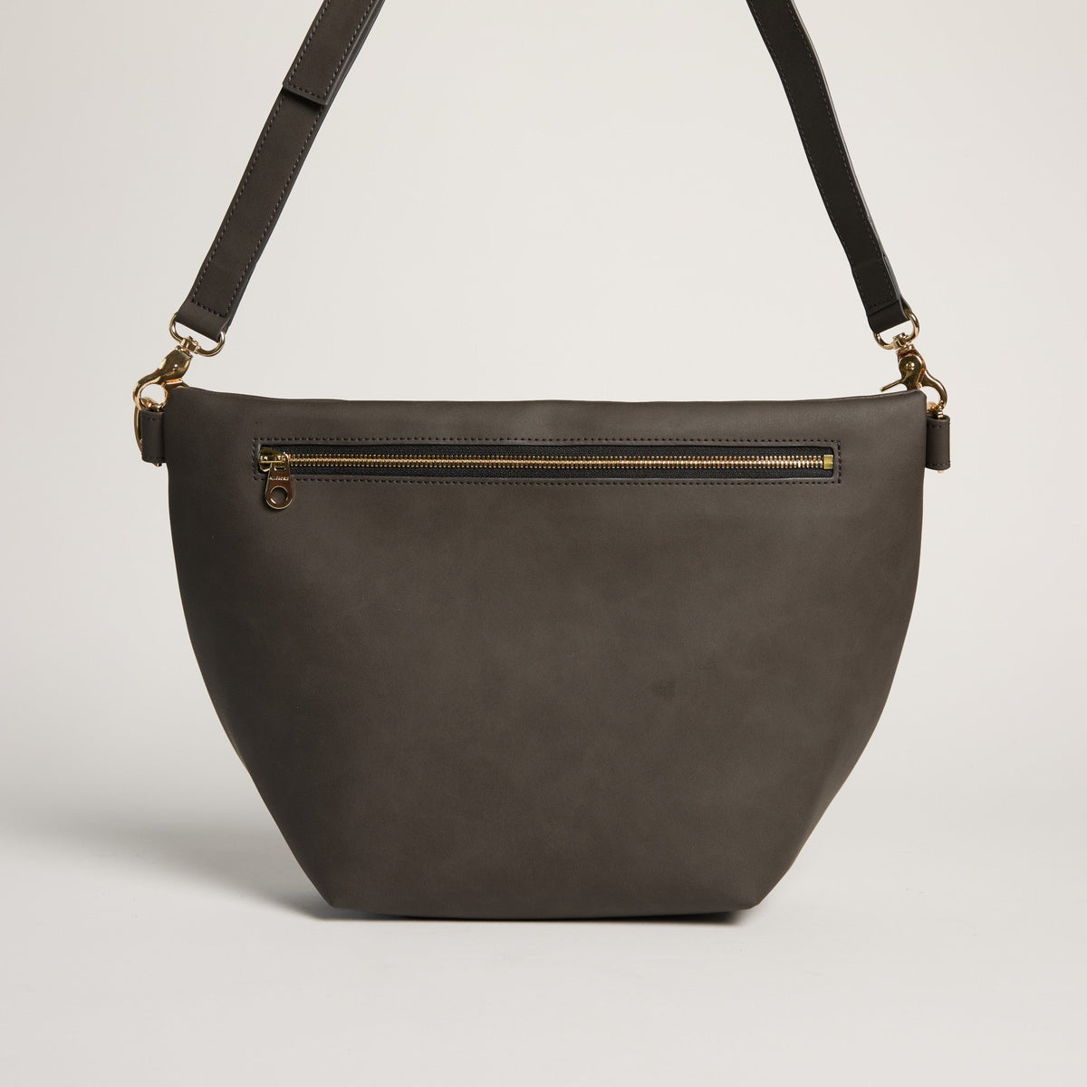 Dark grey Pineapple Hobo Fanny Bag by Allégorie featuring a casual, curved design with a pineapple logo detail.