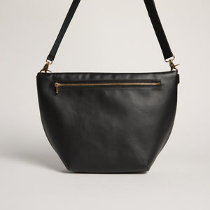 Allégorie Gala Hobo Fanny Bag in black leather, featuring a sleek design with adjustable strap and minimalist style.