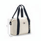 ARTI cream duffle bag with spacious design and sturdy handles
