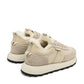 Alaska® Outerwear Company Alpine Shearling Sneaker showing beige shearling-lined shoes with laces and rugged sole.