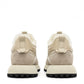 Alaska® Outerwear Company Alpine Shearling Sneaker showing beige shearling-lined shoes with laces and a casual design.