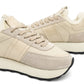 Alaska® Outerwear Company Alpine Shearling Sneaker showing beige shearling-lined shoes with laces and casual design.