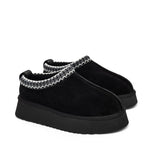 Black Alaska shearling slippers in boot style from Alaska® Outerwear Company, showing cozy shearling lining and durable outer material.