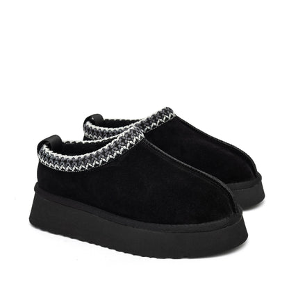 Black Alaska shearling slippers in boot style from Alaska® Outerwear Company, showing cozy shearling lining and durable outer material.