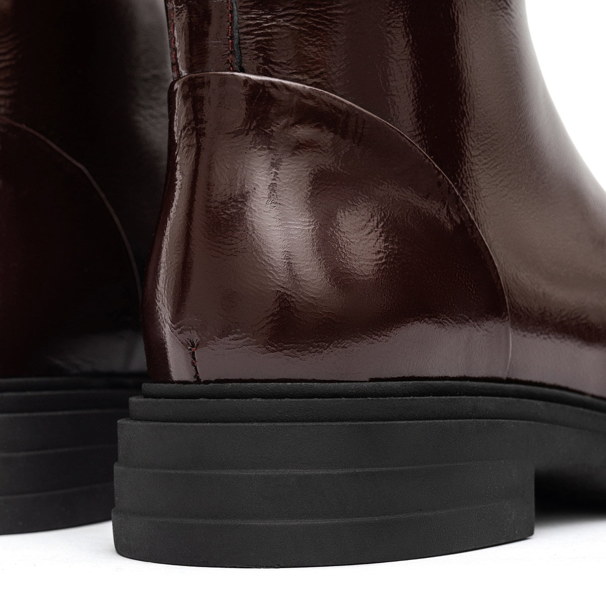 Bordeaux leather zip boots for women by Alaska® Outerwear Company, showcasing stylish ankle shoes with side zipper detail.