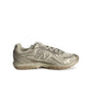 New Balance women's 204L light bronze footwear with metallic accents, showcasing stylish and comfortable athletic shoes.