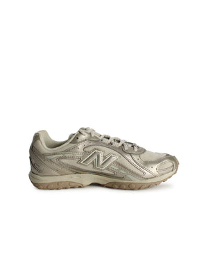 New Balance women's 204L light bronze footwear with metallic accents, showcasing stylish and comfortable athletic shoes.