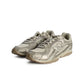 New Balance women's 204L light bronze footwear, showing the stylish design and metallic gold accents.