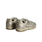 New Balance women's 204L light bronze footwear with Timberwolf gold metallic accents, showcasing stylish and comfortable sneakers.