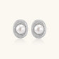 Elegant stud earrings with cream freshwater pearls surrounded by sparkly pavé crystals on rhodium-plated silver setting