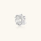 Wide band ring with sculptural wave ripples in polished white gold plated eco-brass on cream background