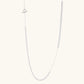 Long sterling silver beaded necklace with graduated sphere design, toggle clasp, and delicate chain extension on white background