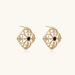 Gold filigree stud earrings with navy lapis lazuli center stone and mother-of-pearl accents in ornate quatrefoil design