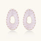 Oval lavender enamel earrings with marbled finish and gold-plated beaded border on cream background.